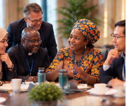 Global mental health and faith leaders talking around a table